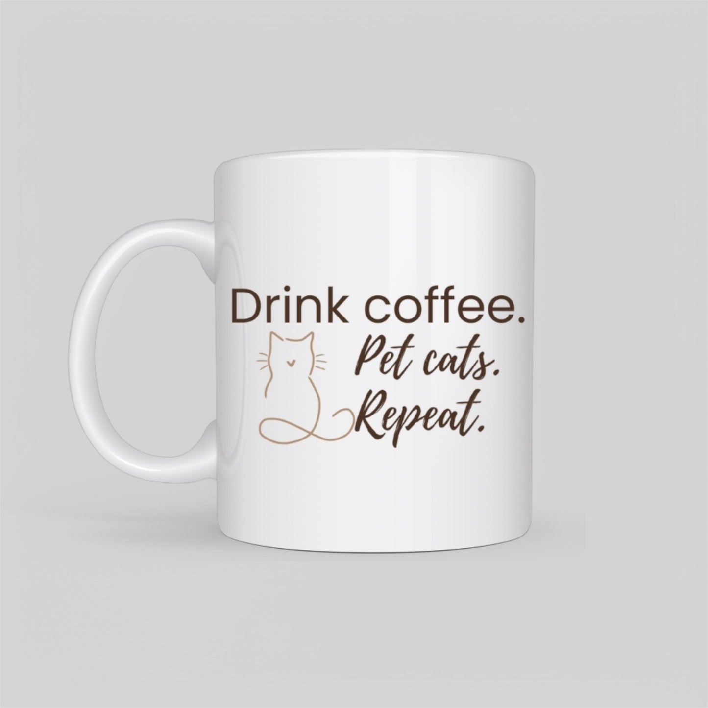 White ceramic coffee mug featuring a minimalist cat outline and the phrase “Drink Coffee. Pet Cats. Repeat.” in soft blush tones. A perfect gift for cat moms, pet lovers, and coffee addicts.