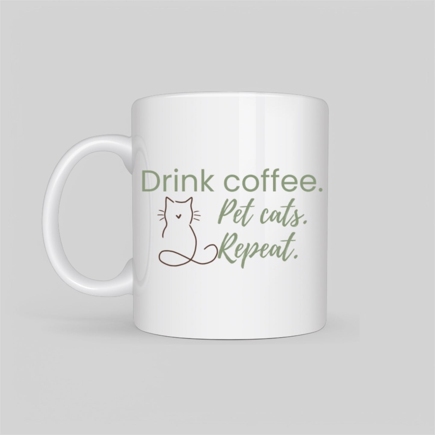 White ceramic coffee mug featuring a minimalist cat outline and the phrase “Drink Coffee. Pet Cats. Repeat.” in soft blush tones. A perfect gift for cat moms, pet lovers, and coffee addicts.