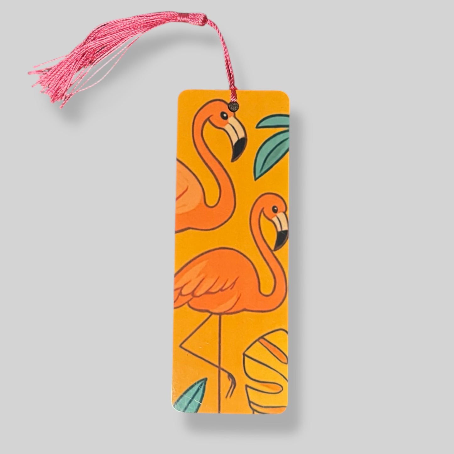 Illustration of a flamingo with tropical leaves on an orange background for a summer-themed bookmark.