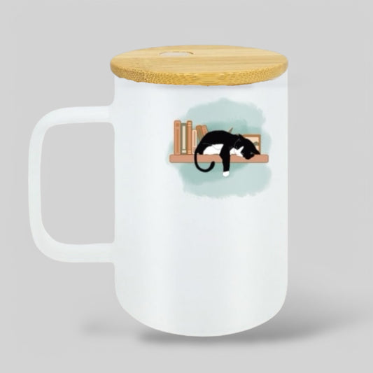 Aesthetic frosted glass mug with bamboo lid, showcasing a cozy black-and-white cat napping on a bookshelf with a watercolor-style background. Ideal for book lovers, cat parents, and cozy home decor.