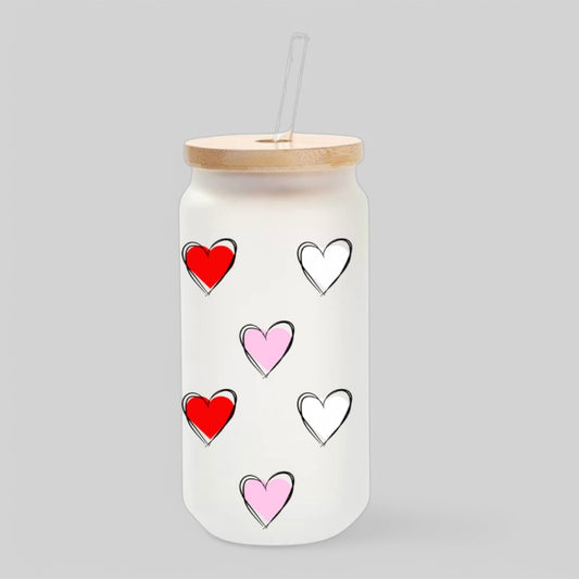 Frosted glass tumbler with hand-drawn red, pink, and white hearts, featuring a bamboo lid and glass straw for a stylish Valentine’s or everyday iced coffee cup