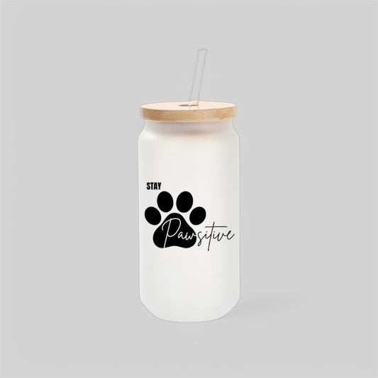 Trendy frosted glass can with bamboo lid and glass straw, featuring a bold black paw print and “Stay Pawsitive” script. A stylish and motivational gift for pet lovers, dog moms, and coffee lovers alike.