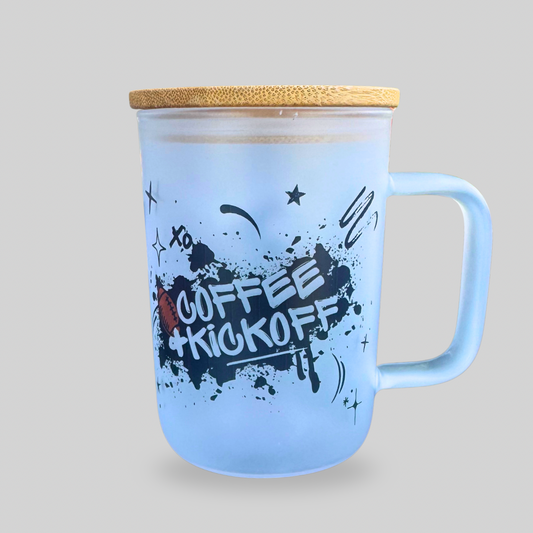 Frosted glass mug with handle, bamboo lid, and Coffee + Kickoff football design — reusable cup with glass straw for game day coffee or iced drinks.