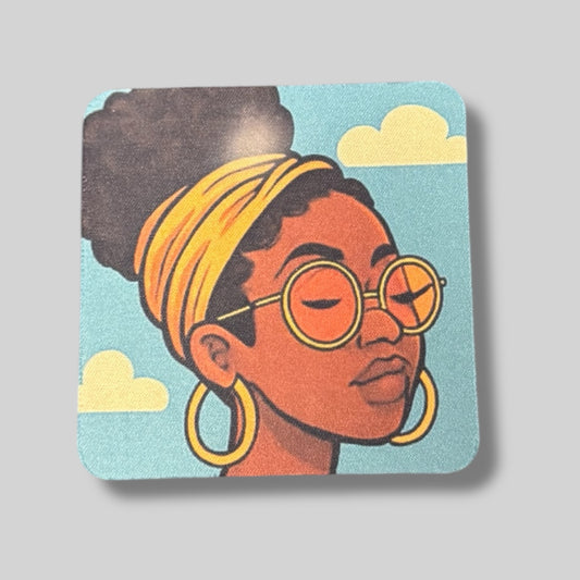 Coaster with woman wearing glasses and a yellow headband, clouds in the background.