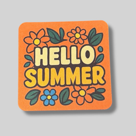 Orange coaster with colorful flowers and bold text that says “Hello Summer.”