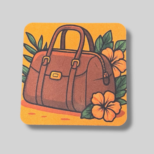 Stylish coaster with a handbag illustration surrounded by hibiscus flowers and leaves.